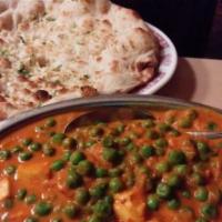 Mattar Paneer Ala Carte · Cheese and peas cooked in spices. Served with pillaw rice, dhal and onion chutney. Vegetarian.