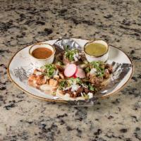Mini Street Tacos · 4 small corn tortillas served open faced with one of each steak, carnitas, chorizo or chicke...