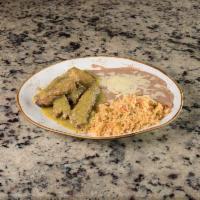 Costillas En Salsa Verde · Our traditional plate. Pork ribs topped with tomatillo green sauce or red sauce. Served with...