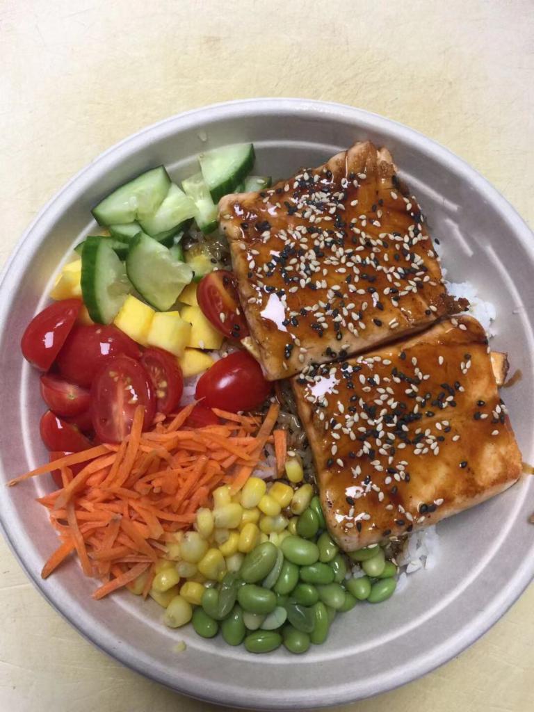 Grilled Salmon Bowl · Carrot, sweet corn, cherry tomato, cucumber, mango, sesame seeds with teriyaki sauce.
