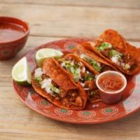 Birria taco  · Corn homemade tortilla with stew meat, cilantro, onion and beans