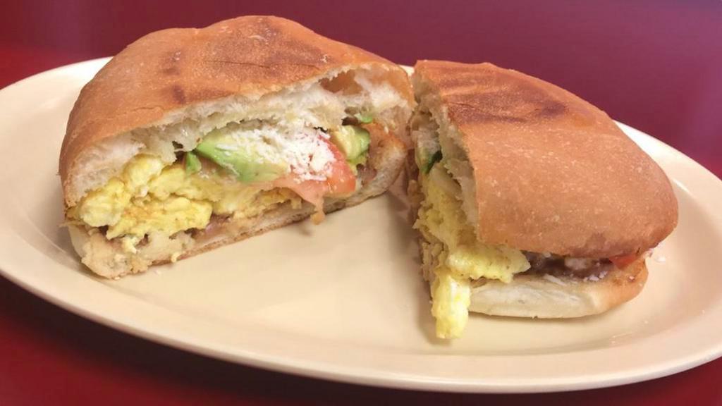 TORTAS · Your choice of meat, fried beans, lettuce, tomato, avocado and jalapeños.