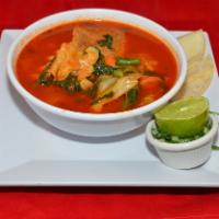 Mole de Olla · Served with corn tortillas or bread. Beef , fresh vegetables and potatoes cooked in a red mo...