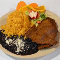 Milanesa De Res · Breaded beef cutlets. Served with rice, beans and tortillas. 