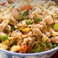 Chicken Fried Rice · Steamed rice stir fried with chicken, eggs, peas, carrots and green onions.