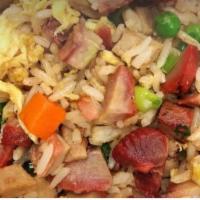 BBQPORK Fried Rice · Steamed rice stir fried with bbq pork,  eggs, peas, carrots and green onions.