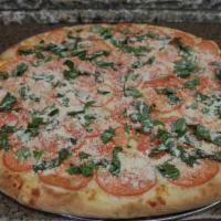 Romano Pizza · Freshly grated mozzarella cheese, sliced tomatoes, fresh basil, Parmesan cheese and garlic.