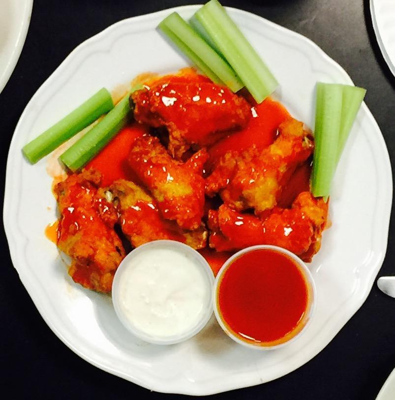 Buffalo Wings · Buffalo wings served with your choice of blue cheese or Ranch dressing and your choice of hot or extra hot sauce.  We serve our sauces on the side to keep your wings nice and crunchy.