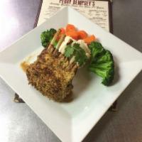 Dempsey's Lamb Lollipops · 4 grilled New Zealand baby lamb chops over mashed potatoes and fresh vegetables, topped with...