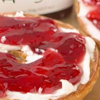 Bagel with Cream Cheese and Jelly · Ring shaped bread roll with soft mild cheese and jelly.