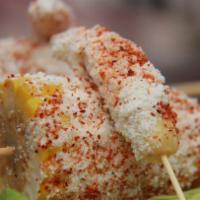 Mexican Street Corn · Corn on the cob, chipotle mayo, Cotija cheese and Tajin.