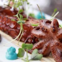 Octopus Asado  · Portuguese octopus served with roasted potatoes, chorizo aioli, acai berry mayo, pistachio m...