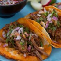 Tacos de Birria  · 3 pieces. Slow cooked birria, cilantro, pickled red onions, red sauce served with burria soup.