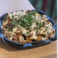 Shawarma Fries · Bunch of house specialty cut scoop fries topped with choice of Gyro, Steak or chicken. Serve...