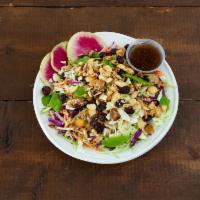 Asian Slaw Salad · Shredded cabbage, carrot, edamame, scallions, peppers, cilantro, toasted candied almonds, an...