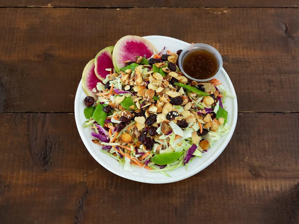 Asian Slaw Salad · Shredded cabbage, carrot, edamame, scallions, peppers, cilantro, toasted candied almonds, and cranberries with soy sesame vinaigrette.
