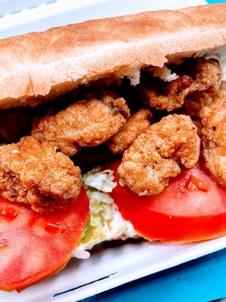 Oyster Po' Boy · Fried Oysters, Lettuce, Tomatoes, and Cajun mayonnaise with spices.  