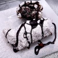 Red Velvet Eggrolls  · Red Velvet Cake, blended with White Chocolate chips, and rich cream-cheese icing- wrapped in...