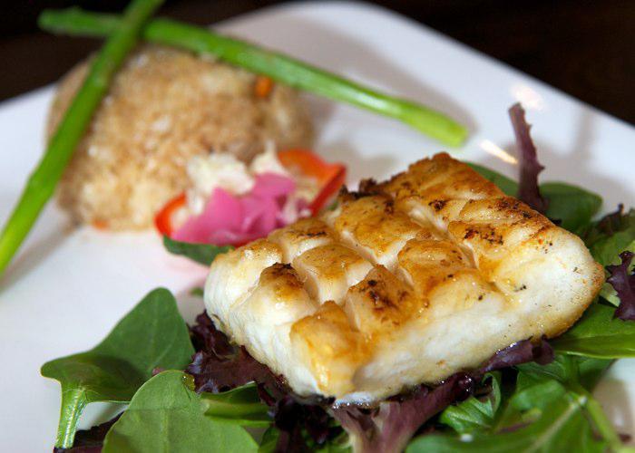 Garlic Chilean Sea Bass · Toasted honey Chilean sea bass with aged black miso sauce.