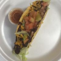 16. Black Bean Taco · Fried corn tortilla or soft flour tortilla topped with cheddar cheese and served with iceber...