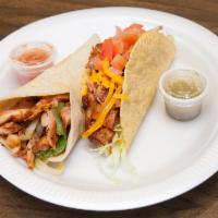 20. Chicken Taco · Grilled chicken. Fried corn tortilla or soft flour tortilla topped with cheddar cheese and s...