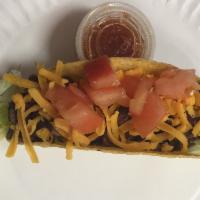 21. Steak Taco · Grilled steak. Fried corn tortilla or soft flour tortilla topped with cheddar cheese and ser...