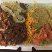 C3. Grilled Chicken and Steak Combo · Served with Mexican rice, black bean, lettuce, tomatoes, cheese, guacamole, onions and 2 fre...