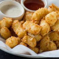 Wisconsin Fried Cheese Curds · Honey hot sauce, horseradish aïoli