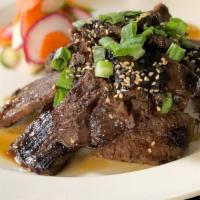 Grilled Korean BBQ Beef · Boneless short ribs, jasmine rice, pickled vegetables, sweet soy ginger sauce.