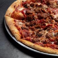 The Carnivore Pizza · Pepperoni, seasoned beef, spicy sausage, crispy bacon, mozzarella, tomato sauce.