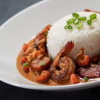 Spicy Jambalaya · Choice of linguine or rice, blackened shrimp, andouille sausage, crawfish, chicken, peppers,...