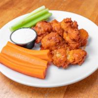 Smoked Buffalo Wings · House smoked chicken wings tossed in your choice of sauce (classic Buffalo, BBQ, teriyaki, m...