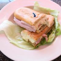 Cuban Sandwich · Pork, ham, Swiss cheese and pickles.