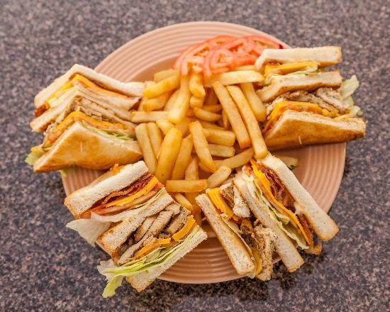 Chicken Club Sandwich · Chicken, bacon, cheese, lettuce and tomato. Served with french fries.