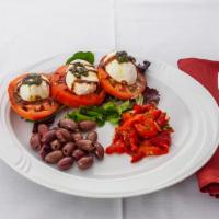 Caprese Salad · Fresh mozzarella, sliced ripe tomatoes, red roasted peppers  and Italian olives, balsamic re...