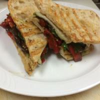 Grilled Milano Panini · Grilled eggplant, roasted red peppers, provolone cheese, creamy pesto mayonnaise and baby le...