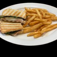 Grilled Toscani Panini · Thinly sliced prosciutto ham, fresh mozzarella, extra virgin olive oil and baby lettuce.