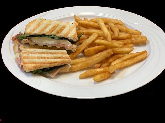 Grilled Toscani Panini · Thinly sliced prosciutto ham, fresh mozzarella, extra virgin olive oil and baby lettuce.