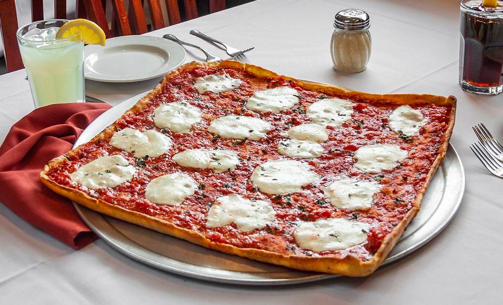 Brooklyn Pizza · Thin crust square pizza with chunks of tomato, fresh mozzarella and basil.