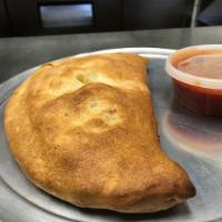 Calzone · With ricotta mozzarella and sauce on the side.