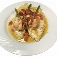 Chicken and Shrimp Princess · Chicken breast sauteed in a white wine garlic sauce with shrimp, asparagus and sun-dried tom...