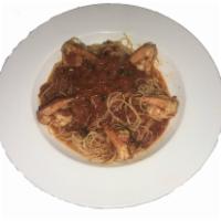 Shrimp Fra Diavolo · Jumbo shrimp sauteed in a hot marinara sauce, served over linguine. Served with choice of sa...