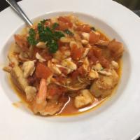 Seafood Ninfea · Jumbo lump crab meat, scallops and jumbo shrimp sauteed in a white wine garlic sauce with fr...
