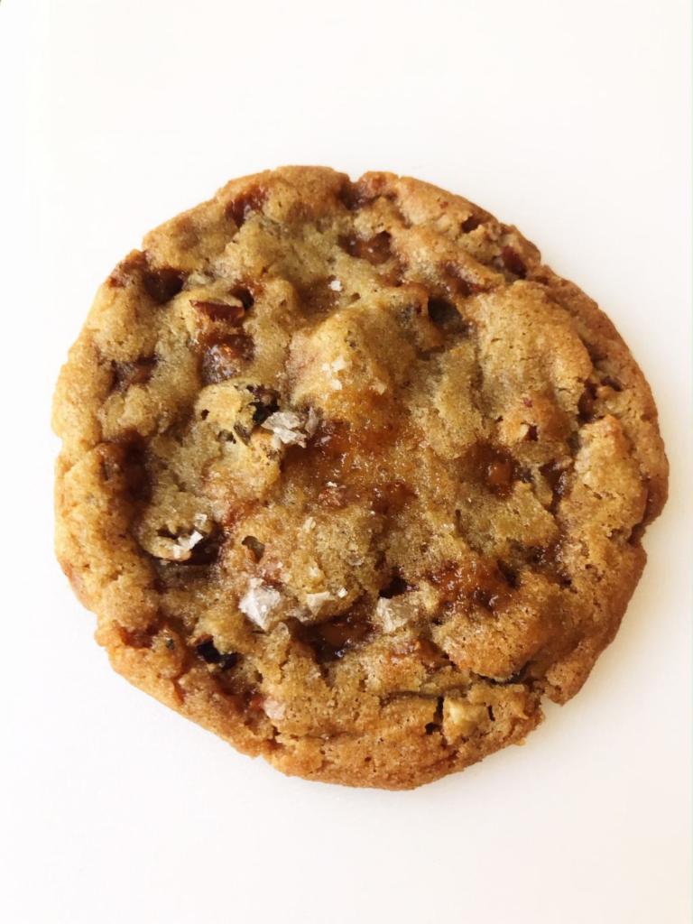 Salted Toffee Pecan · This brown butter cookie is loaded with toffee pieces, toasted pecans, and sea salt. The perfect combo of sweet, salty, and crunchy!