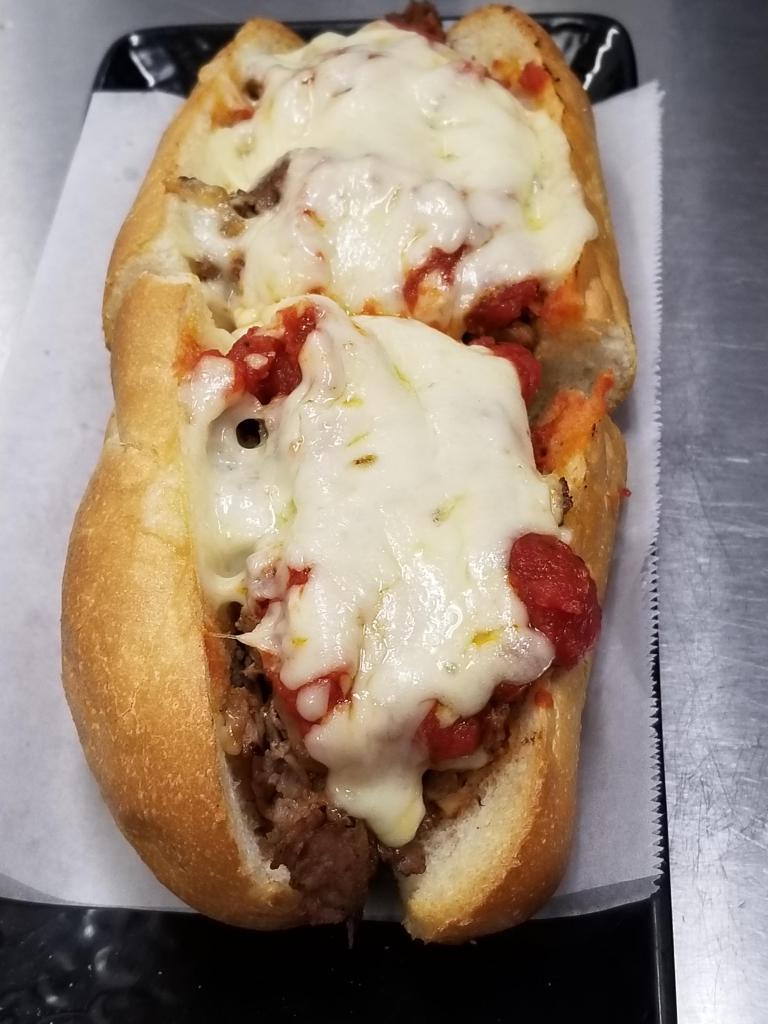Pizza Steak Sandwich · 1/2 lb. of 100% sirloin beef served on a footlong roll. Available with sauteed onions upon request.