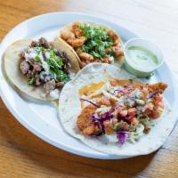 Taco de Pollo · Marinated chicken breast, cilantro, onion and on a corn tortilla.