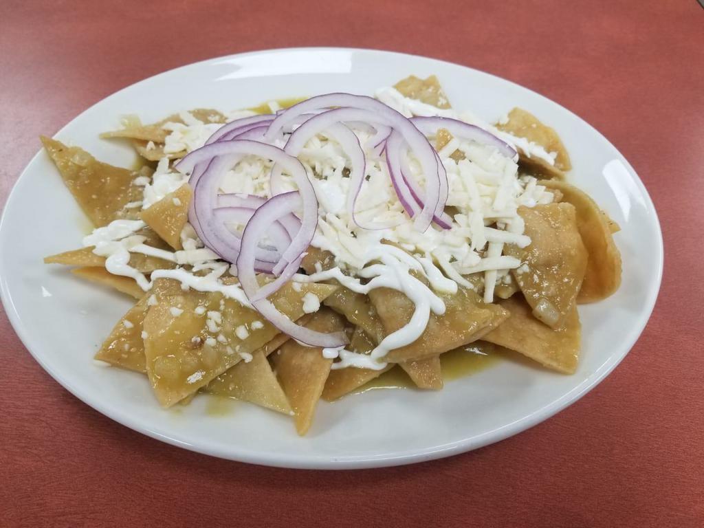 Chilaquiles · Verdes o rojos. Pollo, bistec o huevos fritos. Tortilla chips dipped in green or red sauce (chicken, steak or fried eggs).