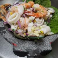 Ceviche Mixto · Pescado y camaron. Peruvian style mixed salad (fish and shrimp).
