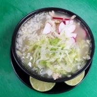 Pozole · Pollo o puerco. Mexican style hominy soup (chicken or pork).