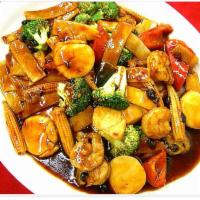 S13. Scallops and Jumbo Shrimp · Fresh scallops and jumbo shrimp with mixed vegetable in garlic sauce. Choice of rice. Hot an...